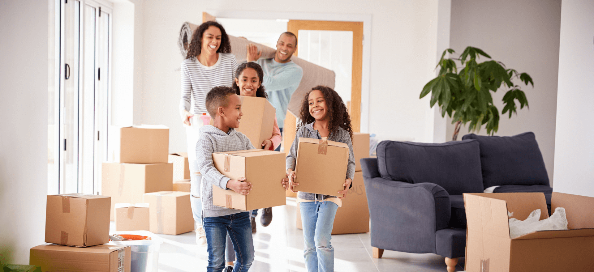 Happy family moving in to their new home thanks to Properties & Notes Investments